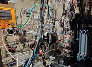 Photo of the ALS X-ray room with sample chamber. The X-ray beam comes out of from the grey slot just to the left of the chamber, then through the sample to the detector (photo from Jon Ell).